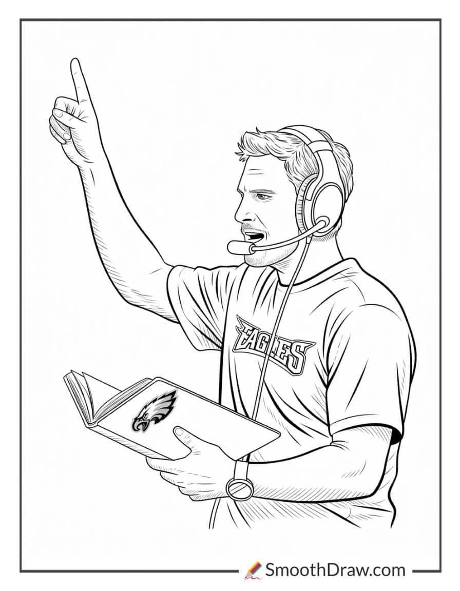 Eagles coach with playbook