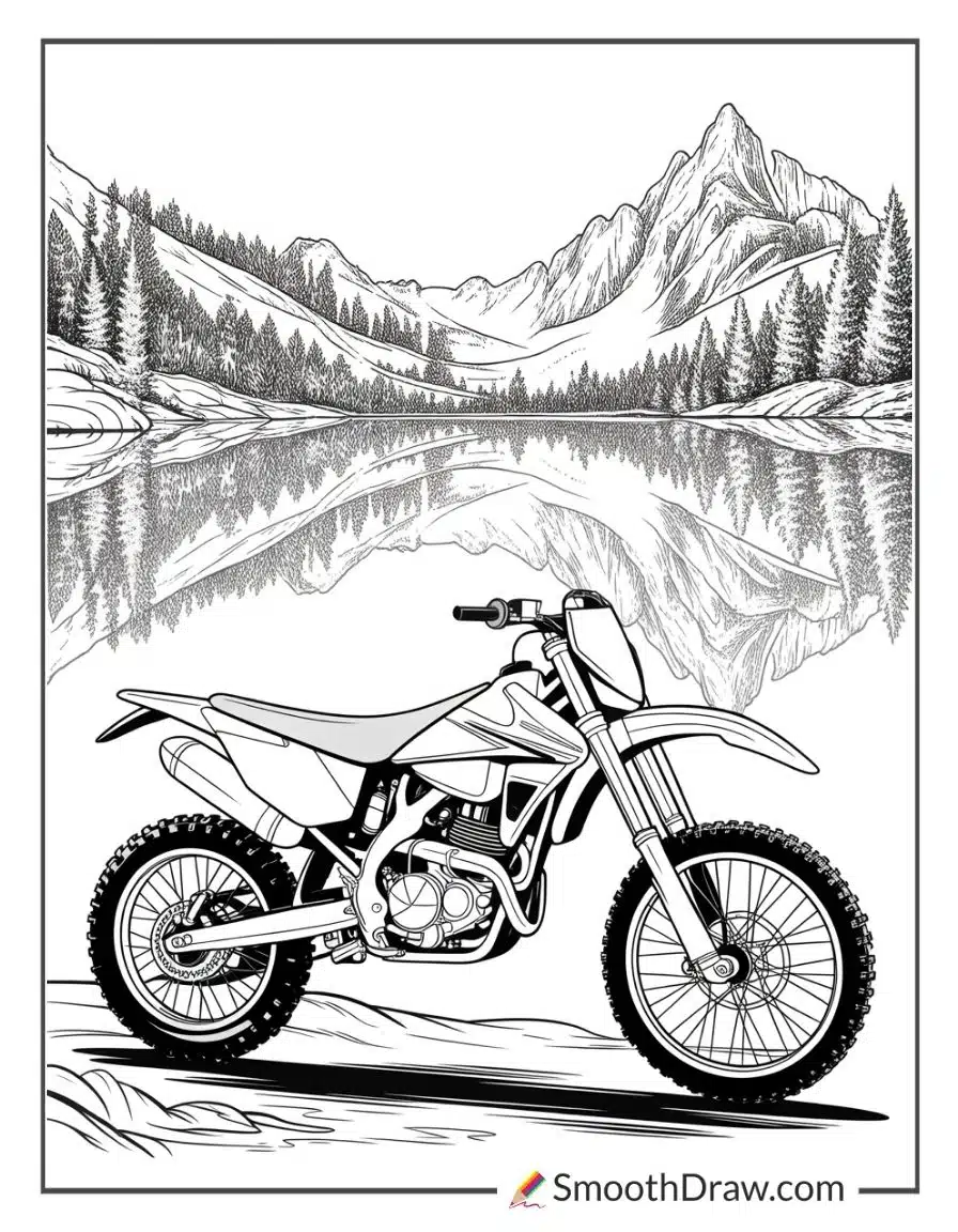Dirt bike parked by mountain lake
